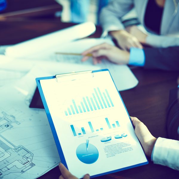 Close up businessman analyzing annual report 600x600