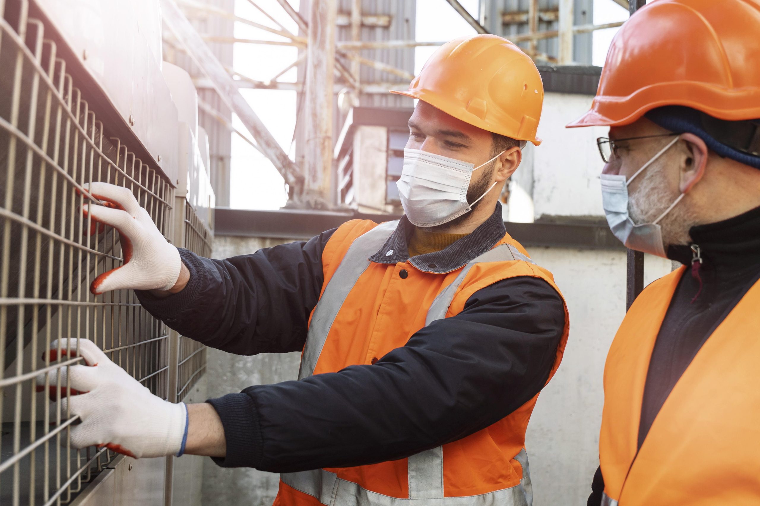 Close up men with masks working together scaled