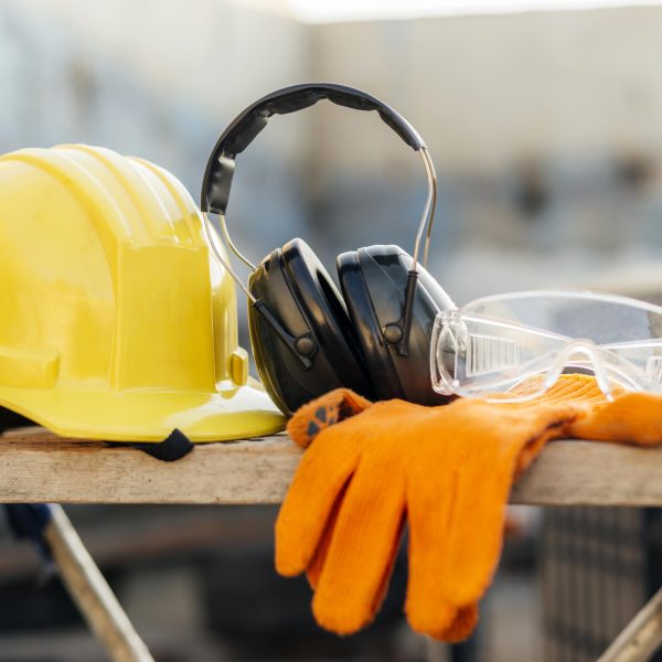 Front view protective glasses with hard hat headphones 600x600